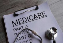 Medicare Shock Looms After 2026? Clipboard with handwritten text about Medicare supplement insurance next to a stethoscope