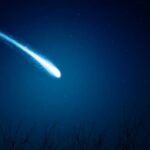 Space Sugar Shocks Origin-Of-Life Debate A bright comet streaking across a dark night sky filled with stars