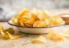 FDA’s HIGHEST Alert Hits Popular Chips A bowl filled with golden, crispy potato chips on a countertop