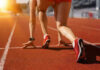 Athlete on starting line of a track.