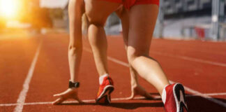 Athlete on starting line of a track.
