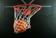 Basketball swishing through a hoop
