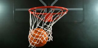 Basketball swishing through a hoop