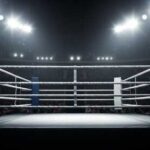 Driver Stops, Reverses, Kills Boxing Pro An empty boxing ring illuminated by bright lights in a sports arena