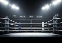 Driver Stops, Reverses, Kills Boxing Pro An empty boxing ring illuminated by bright lights in a sports arena