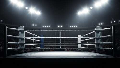 Boxing,Ring,In,A,Packed,Stadium,Under,Bright,Stadium,Lights. An empty boxing ring illuminated by bright lights in a sports arena