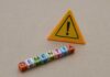 Blood Test Predicts Dementia Decades Early Colorful letter blocks spelling 'DEMENTIA' next to a warning sign