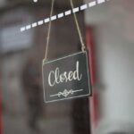 Pizza Bloodbath: 50 Stores Vanish A closed sign hanging on a shop window