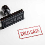 Blood Drop Explodes Cold Murder Case Rubber stamp with the words COLD CASE next to a stamped impression