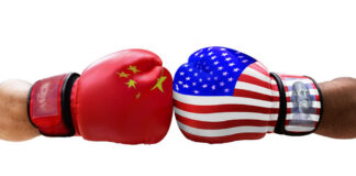 Boxing gloves representing China and the USA facing each other