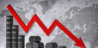 Graph depicting a decline in oil prices with barrels in the foreground