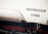 Deportation Deal Sparks Chaos? Close-up of a typewriter with a paper showing the words 'DEPORTATION ORDER'