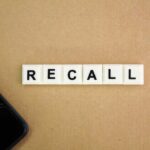 Nationwide Recall Hits Amazon Favorite Letter tiles spelling recall on cardboard with a smartphone corner