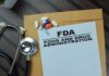 FDA Flags THESE Overpowered Tablets FDA document with pills and a stethoscope on a wooden surface