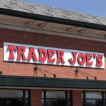 Grocery store exterior with red brick facade and large sign