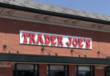Grocery store exterior with red brick facade and large sign