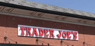 Grocery store exterior with red brick facade and large sign