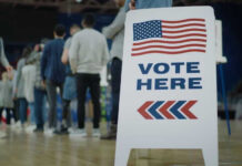 Donor Avalanche Flattens Squad Star People in line next to Vote Here sign