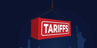 Red shipping container labeled 'TARIFFS' suspended above a city skyline
