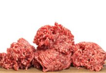 Grass-Fed Gamble Shocks Fast Food Two raw ground meat patties on a dark surface