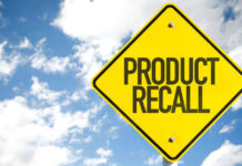 Food Inspection Dodge Sparks Massive Recall Yellow product recall sign against cloudy sky