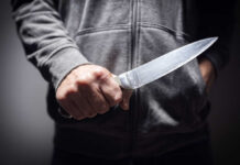 Costco Chaos: Machete Rampage Foiled A person holding a knife in a threatening manner