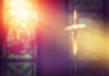 Burial Site Bombshell: Evidence Aligns With Bible Crucifix with sunlight, stained glass window in background.