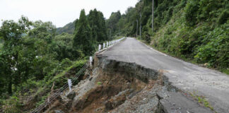 Road partially collapsed due to a landslide.