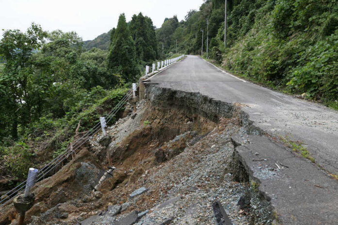 Road partially collapsed due to a landslide.