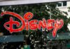 Bad News Slams Disney Again! Bright red Disney logo displayed on a storefront window