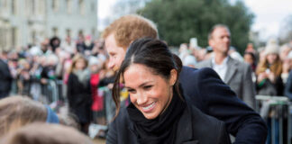 Meghan, Duchess of Sussex greets crowd with Prince Harry, Duke of Sussex nearby
