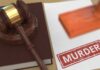Judge's gavel on a law book beside a stamped document