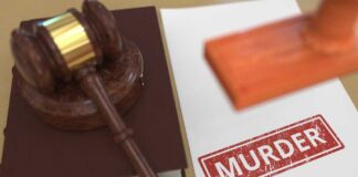 Judge's gavel on a law book beside a stamped document
