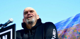 John Fetterman speaking at podium.