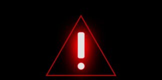 Red warning triangle with exclamation mark on black background
