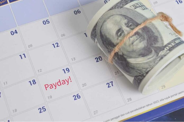 Payday,Refers,To,The,Day,On,Which,An,Employee,Receives A rolled bundle of cash placed on a calendar marked with 'Payday!'