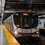 Subway train arriving at an underground platform
