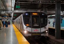 Subway Slasher Vanishes Into Crowd Subway train arriving at an underground platform