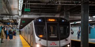 Subway train arriving at an underground platform