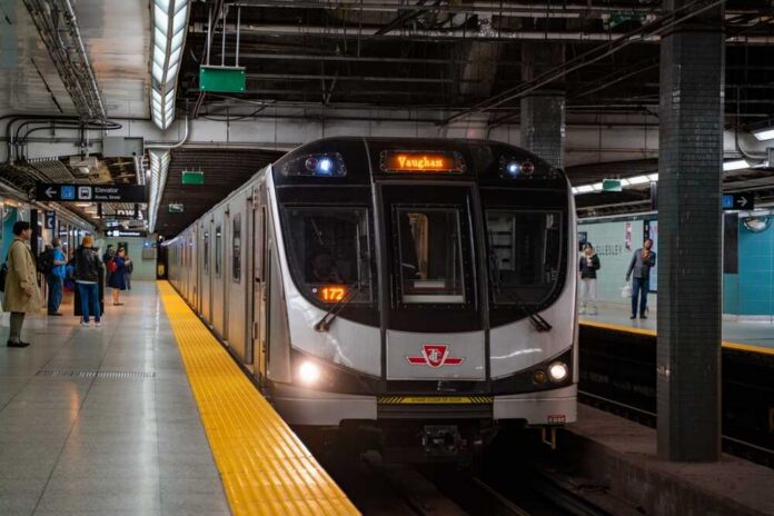 Subway train arriving at an underground platform