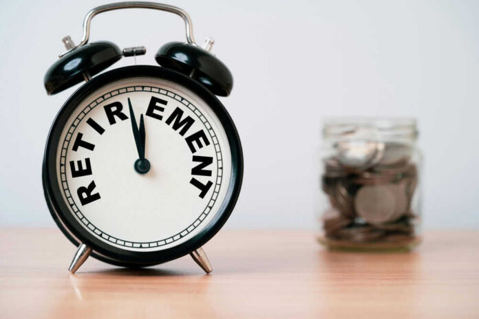 shutterstock_2543233045 Alarm clock showing retirement and jar of coins