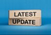 UPDATE: Elementary School Attacked By Gunman Wooden blocks with the words latest update on blue background