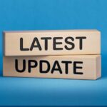 UPDATE: Elementary School Attacked By Gunman Wooden blocks with the words latest update on blue background
