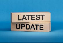 UPDATE: Elementary School Attacked By Gunman Wooden blocks with the words latest update on blue background