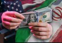 Heavy Users Slapped — Iran’s New Pump Trap Hands holding a $100 bill with American and Iranian flags in the background