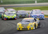NASCAR Legend’s Announcement Shakes Fans Race cars on Daytona track with large audience watching