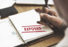 NEW: FBI Agents’ Psych Files Exposed?! A hand stamping the word 'EXPOSED' on a document
