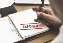 NEW: FBI Agents’ Psych Files Exposed?! A hand stamping the word 'EXPOSED' on a document