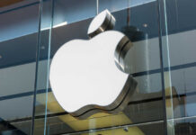 TODAY: New Update Drains iPhones?! Apple logo displayed prominently on a glass storefront