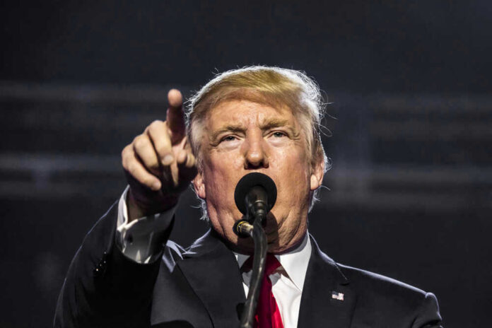 shutterstock_636139745 Donald Trump, points while speaking.